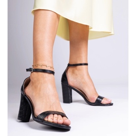 Black sandals on the post 1