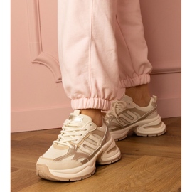 Beige sports sneakers on a massive sole 1