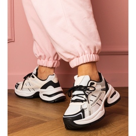 White and white sports sneakers on a massive sole 1 White and white sports sneakers on a massive sole 1