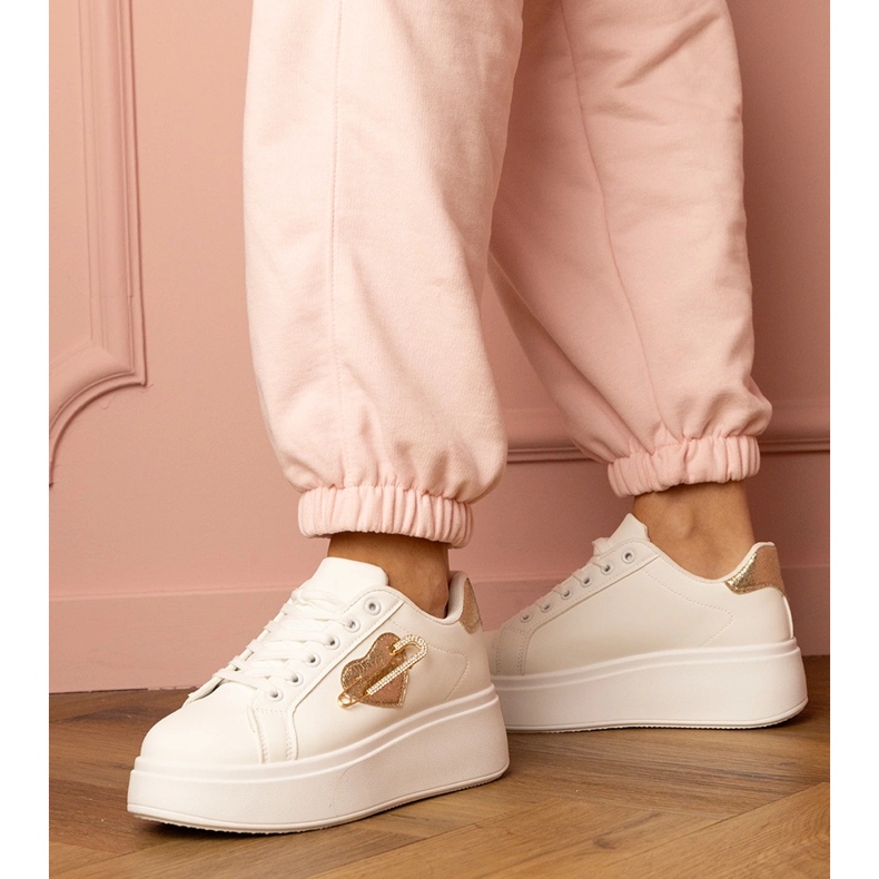 White sneakers with a golden heart and a zircon pins 2