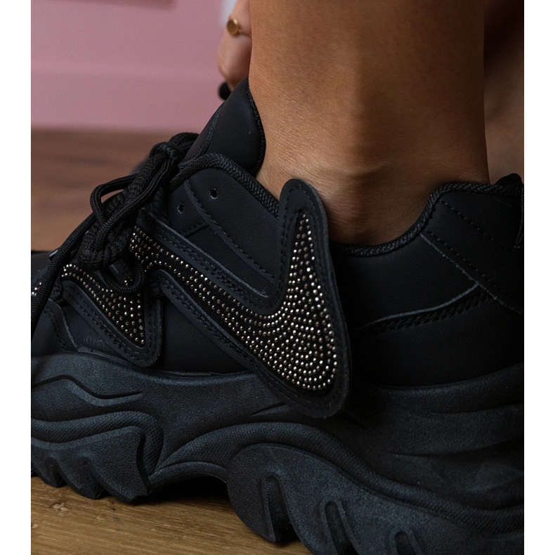 Black sneakers on a massive sole with zircons 1