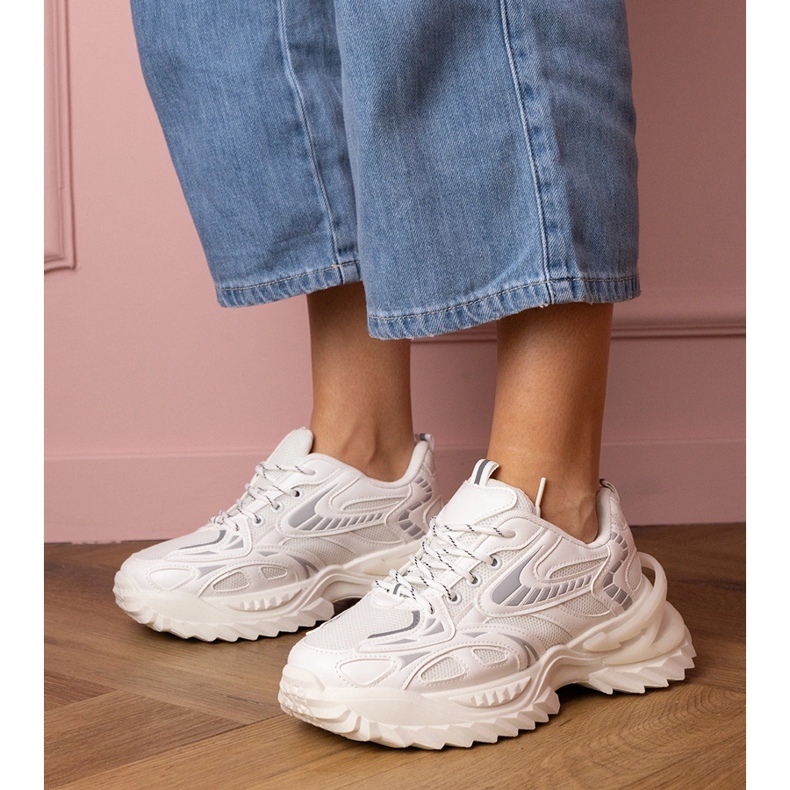 White sports sneakers on a stylish sole 1 White sports sneakers on a stylish sole 1