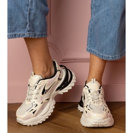 Beige sports sneakers on a stylish sole 1