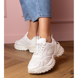 White sports sneakers on a thick sole 1 White sports sneakers on a thick sole 1