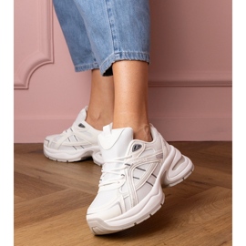 White sports sneakers with a massive sole 1