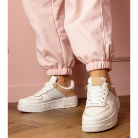 White and beige sports sneakers on platfotm 2