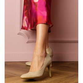 Golden pumps on a brocade finish 1