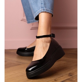 Black shoes varnished on the platform 1 Black shoes varnished on the platform 1