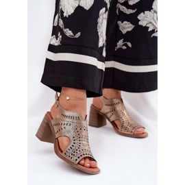 Openwork women's sandals on the golden post 2