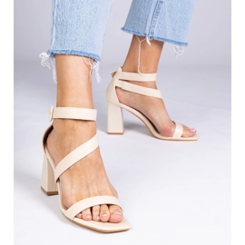 Beige sandals on the post with a buckle 1