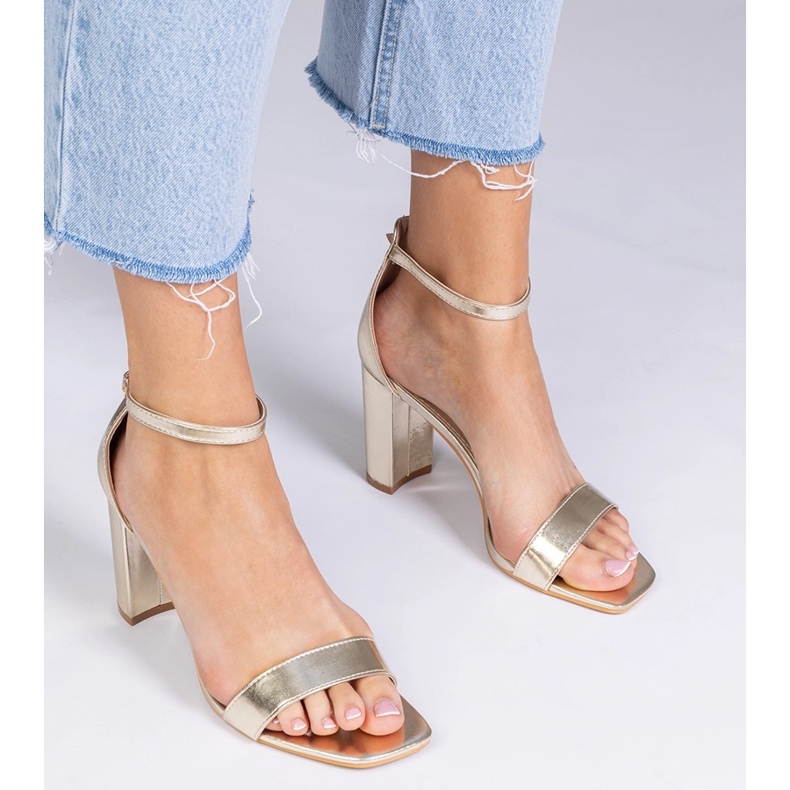 Gold sandals on a high post golden 1