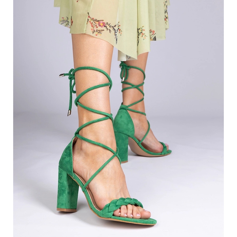 Green sandals tied on the post 1