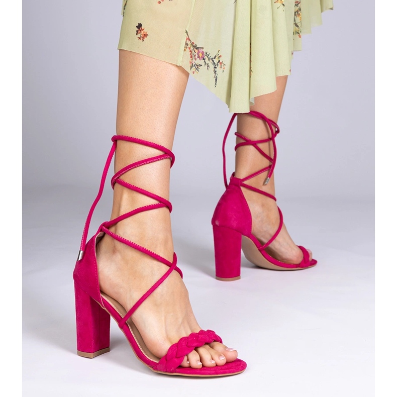 Pink sandals tied on the post 1