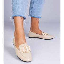 Beige women's loafers with a golden decoration 1