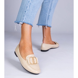 Beige women's loafers with a golden decoration 2