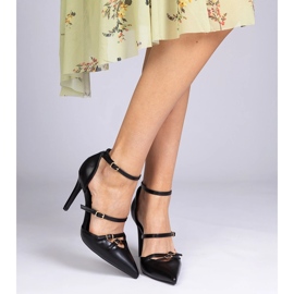Black pumps on a high heel fastened around the ankle 1 Black pumps on a high heel fastened around the ankle 1