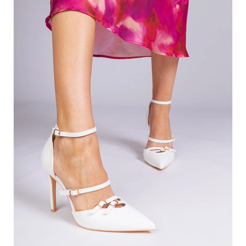 White pumps on a high heel fastened around the ankle 1 White pumps on a high heel fastened around the ankle 1