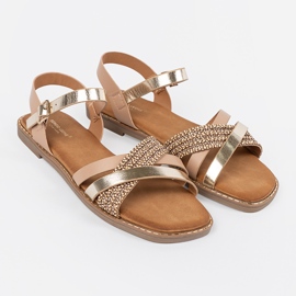 Golden women's sandals on a flat sole Sergio Leone 1