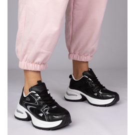 Black sports sneakers on a thick sole 1