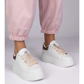 White sneakers with a leopard insert and a zircon pin 1