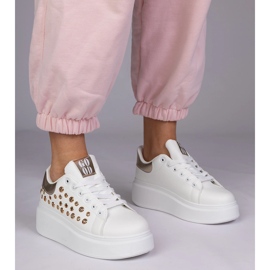 White sneakers with a golden insert and studs 1