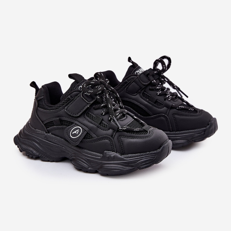 Children's sneakers on the black platform 1