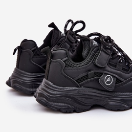 Children's sneakers on the black platform 2