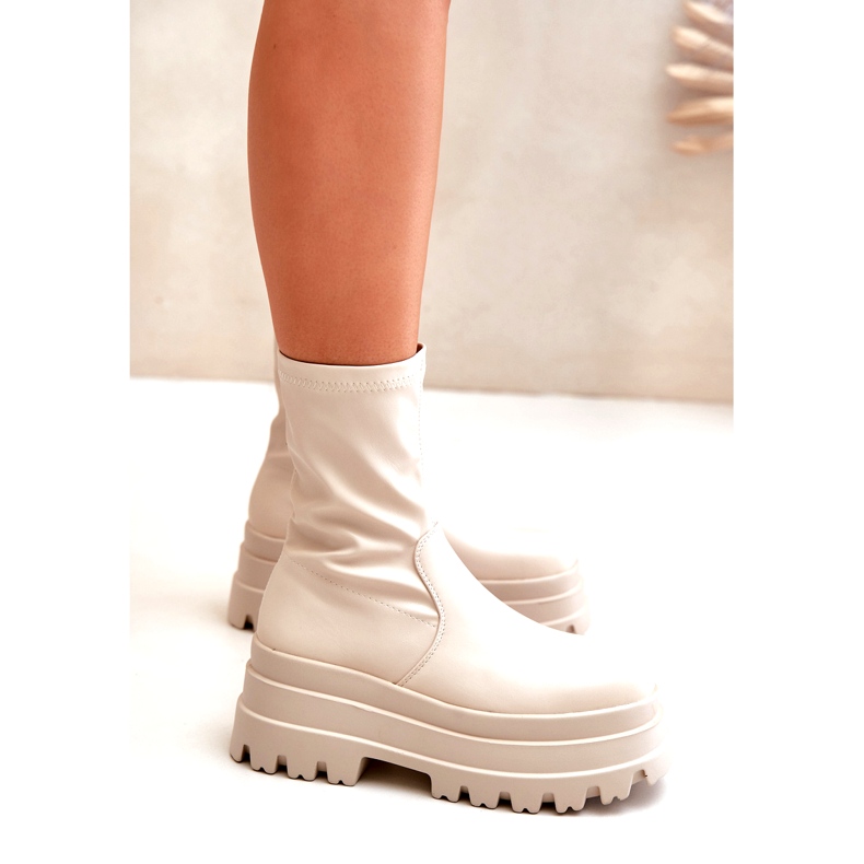 Light beige ankle boots on a massive platform 4