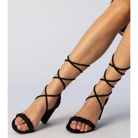 Black sandals tied on the bound post 1