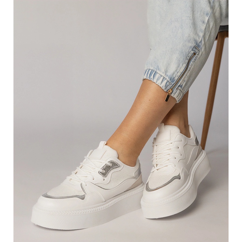 White sneakers with a material insert 1