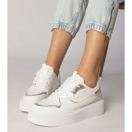 White sneakers with a material insert 2