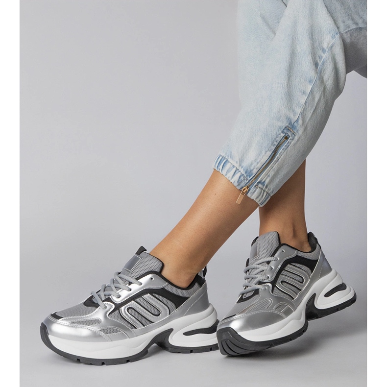 Silver sports sneakers on a massive sole 1