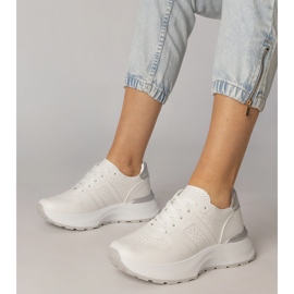 White sports sneakers with a silver insert 1