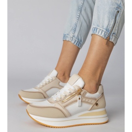 Beige sports sneakers decorated with a slider 1 Beige sports sneakers decorated with a slider 1