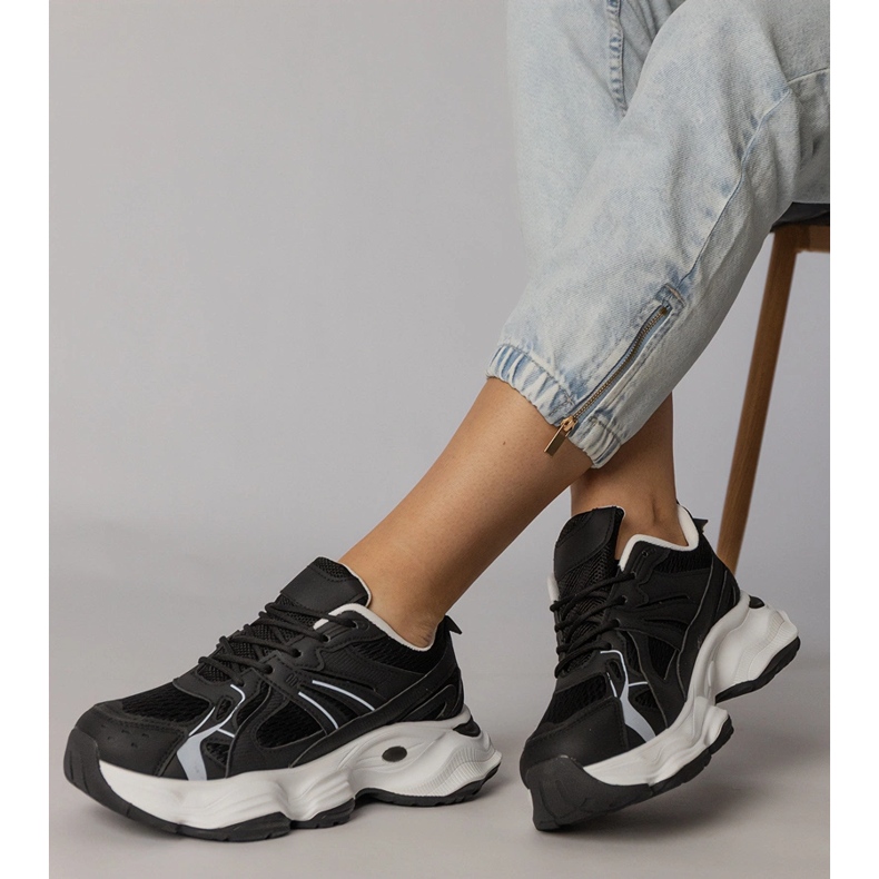 Black sports sneakers on a massive sole 2