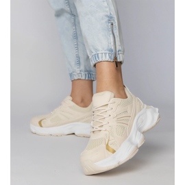 Beige sports sneakers on a massive sole 1
