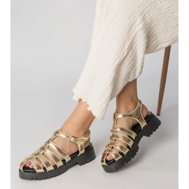 Gold sandals on the platform with a finger line built golden 1