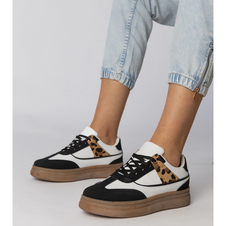 White and white sneakers with a leopard accessory 1