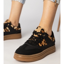 Black sneakers with a leopard accessory 1 Black sneakers with a leopard accessory 1