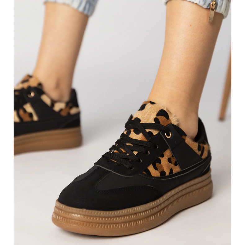 Black sneakers with a leopard accessory 1 Black sneakers with a leopard accessory 1