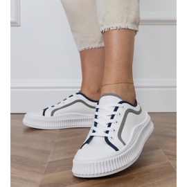 Women's white sneakers on the platform 1