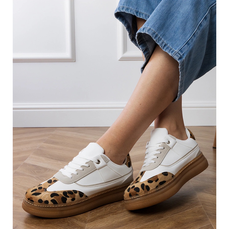White sneakers with a leopard accessory 2
