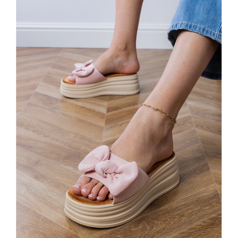 Pink slippers on the platform with a bow 2