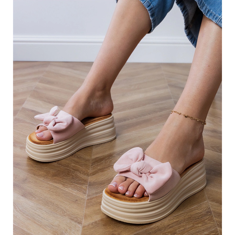 Pink slippers on the platform with a bow 1