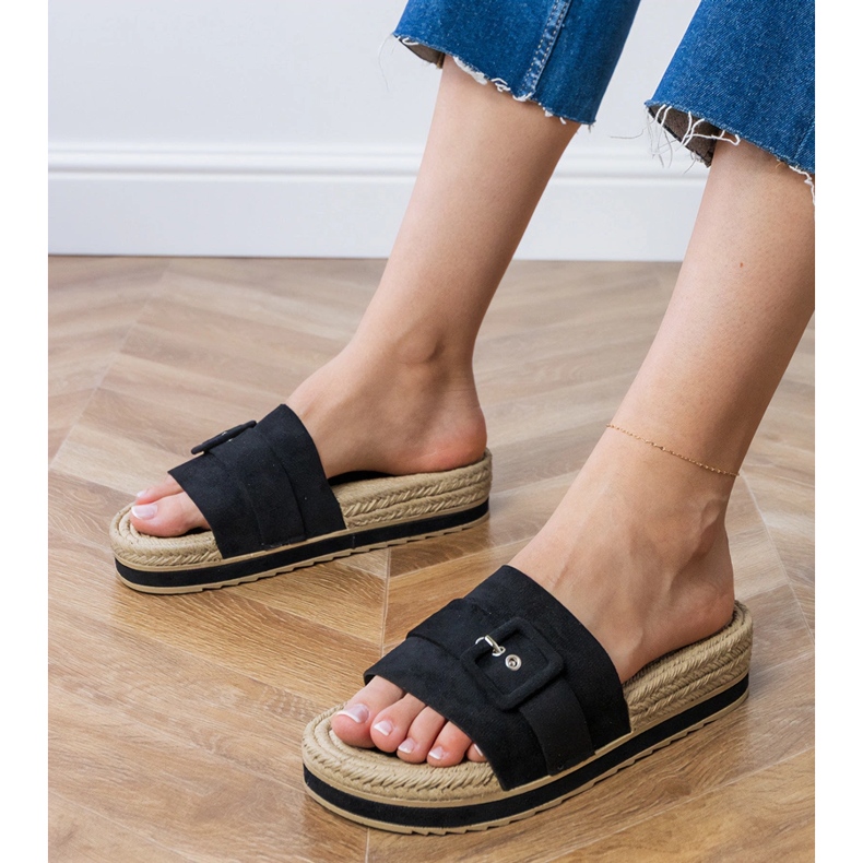 Black flip -flops on the platform with a decorative buckle 1