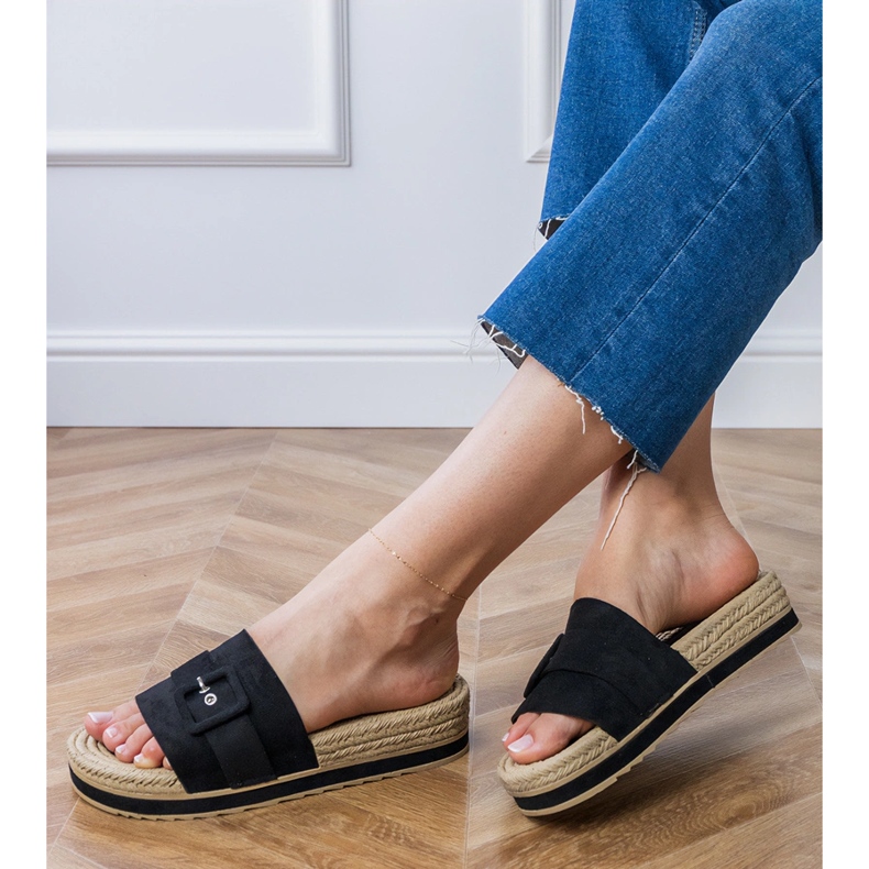 Black flip -flops on the platform with a decorative buckle 2
