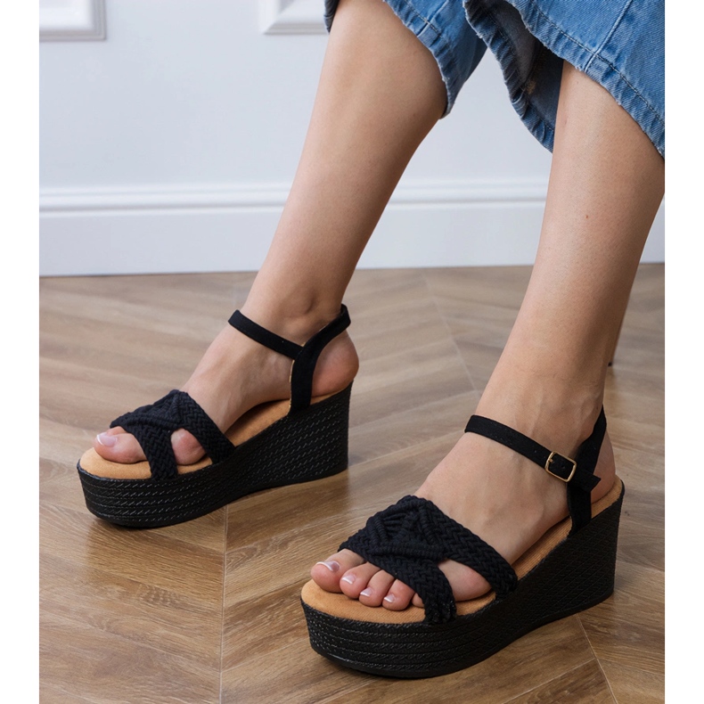 Black sandals on the platform with a tied strap 1