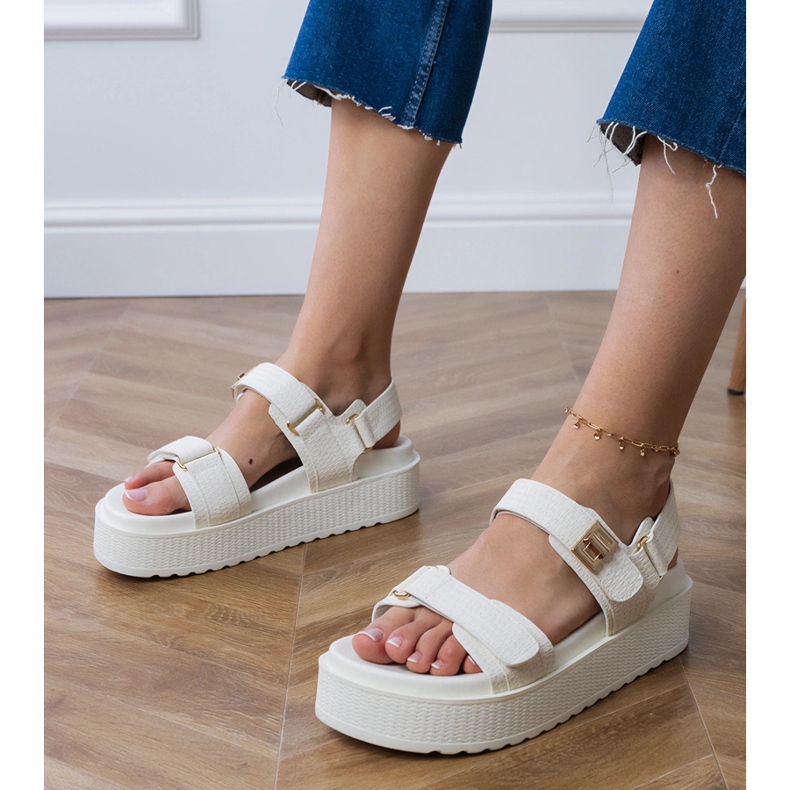 White sandals on the platform with straps on the Velcro 1