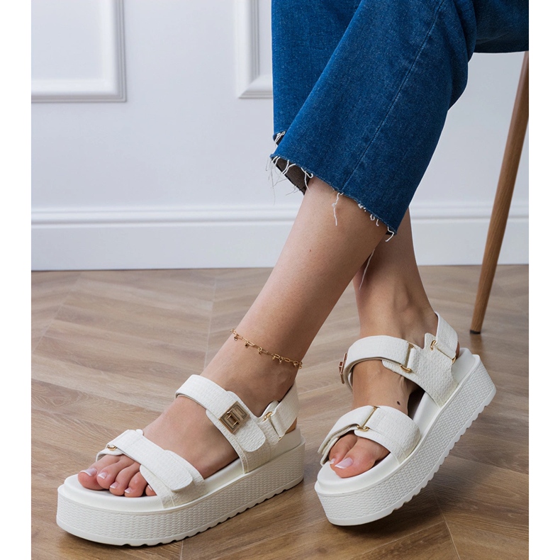 White sandals on the platform with straps on the Velcro 2