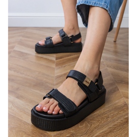 Black sandals on the platform with straps on the Velcro 2